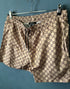 Gcc "G&G ALLOVER PRINT" SwimShorts styled in Beige Spring&Summer 2024 Collection