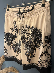 Gucci " Logo " Printed Shorts styled in White/Black for Spring&Summer 2023