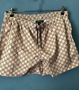 Gcc "G&G ALLOVER PRINT" SwimShorts styled in Beige Spring&Summer 2024 Collection