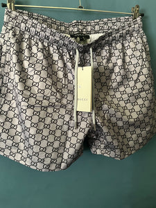 Gcc "G&G ALLOVER PRINT" SwimShorts styled in Gray Spring&Summer 2024 Collection