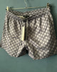 Gcc "G&G ALLOVER PRINT" SwimShorts styled in Gray Spring&Summer 2024 Collection