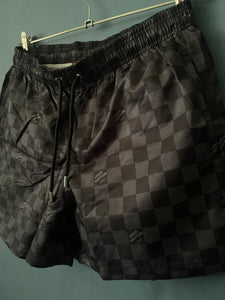 LV "Logogram" SwimShorts styled in Black Spring&Summer 2024 Collection