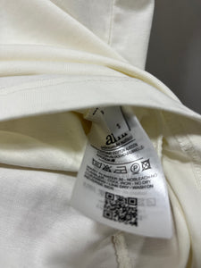 Ami " Logo PLUGGED" Tee styled in White for Spring&Summer 2025
